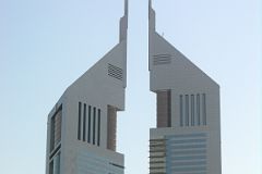 
The taller of the two Emirates Towers on the right (355m, 54 floors, 2000) houses offices. The second Emirates Tower on the left (309m, 56 floors, 2000) is the second-tallest completed all-hotel building in the world, surpassed only by the Burj Al Arab, also in Dubai. This is balanced by the curvilinear base structure.
